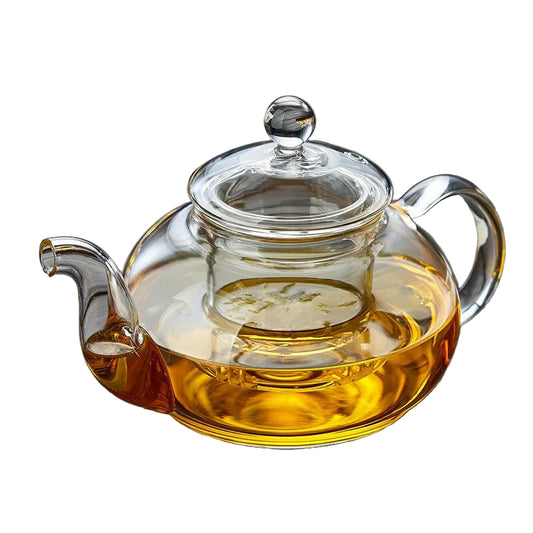 Théière Clara en verre borosilicate transparent avec infuseur inox, remplie de thé